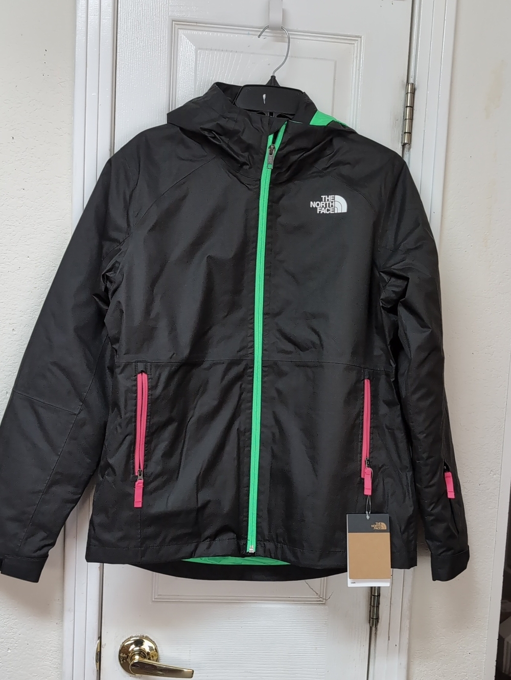 The North Face Black Kids' Hooded Winter Jacket with Green and Pink Accents